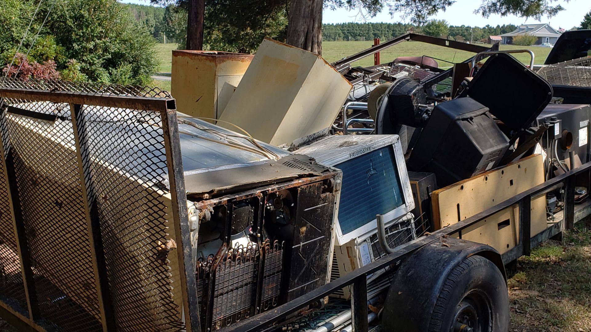 A trailer with a lot of junk on it