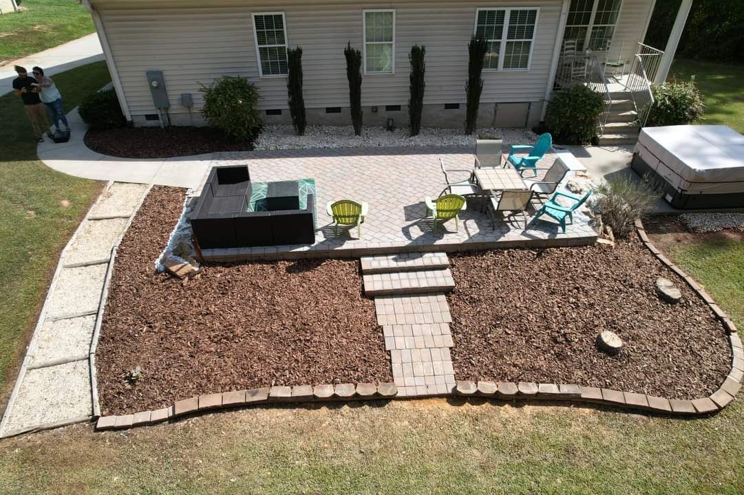 An aerial view of a backyard with a patio