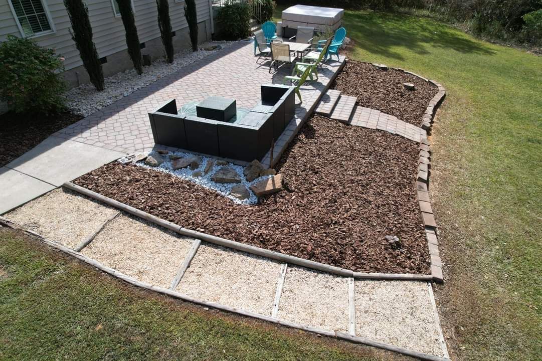 An aerial view of a backyard with a patio