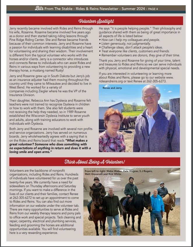 A man and a woman are standing next to horses in a barn.