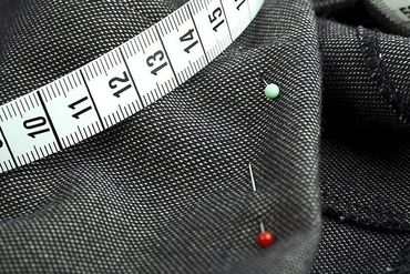 Measuring tape and pinned clothing