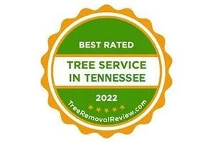 Green and gold award badge reading “Best Rated Tree Service in Tennessee 2022”