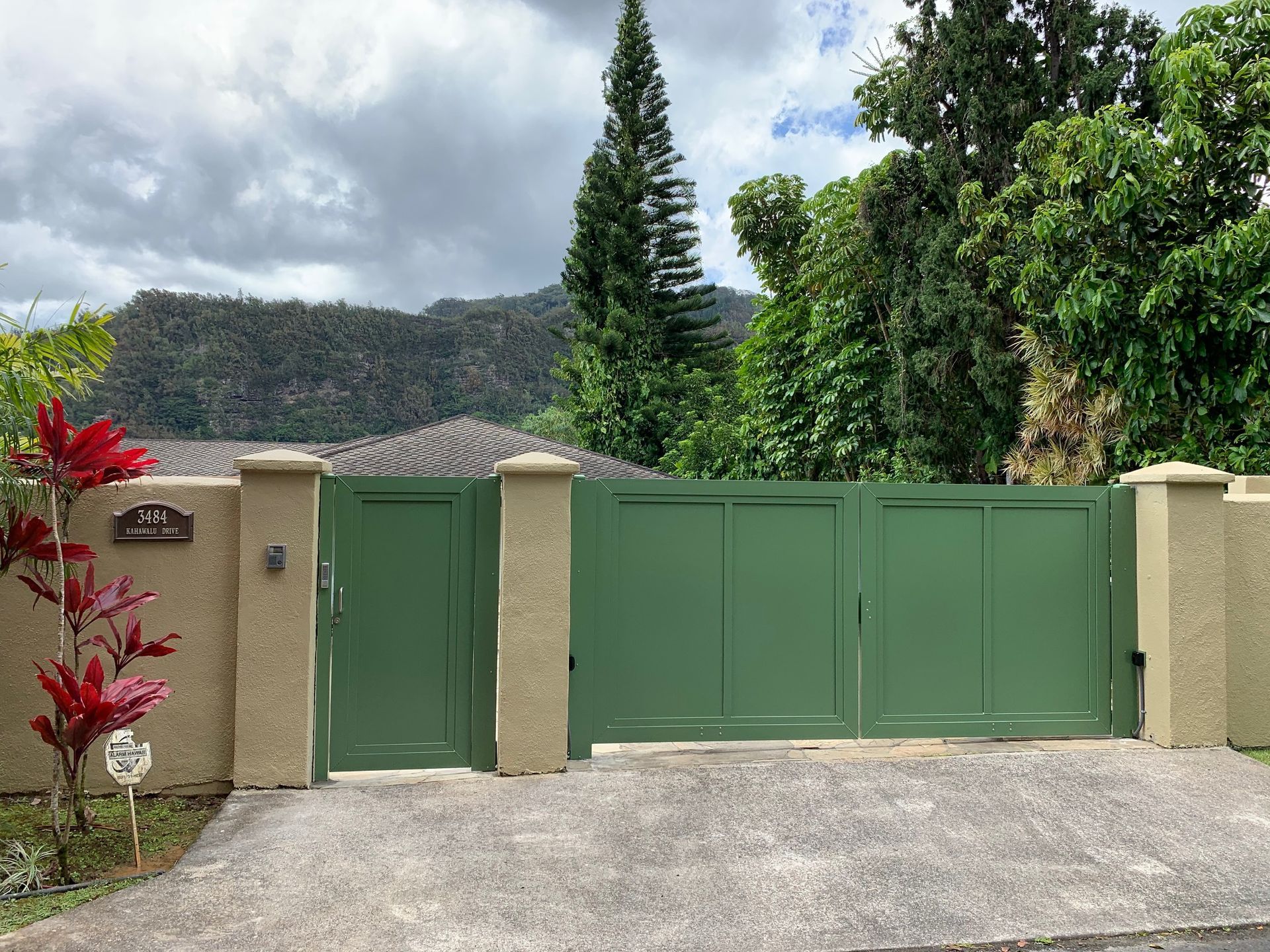 Exterior of building with black metal railing and ramp.