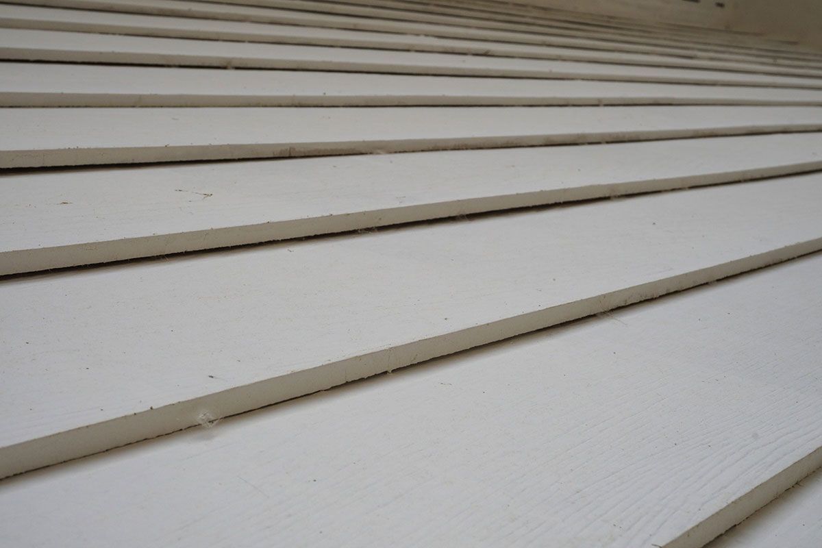 A close up of a white siding on a house.