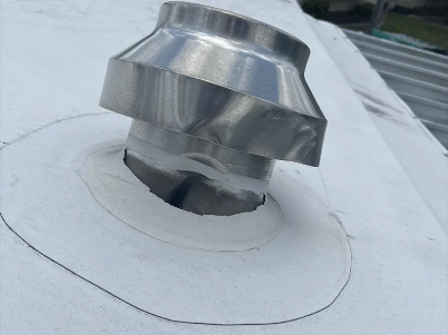 Damaged metal vent pipe protruding from a white roof with a loose flashing ring