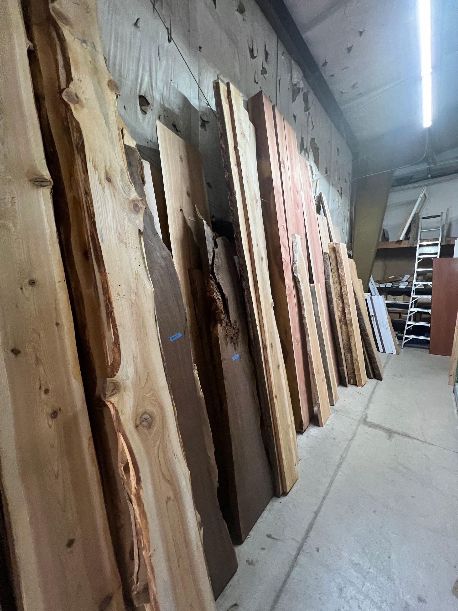 A warehouse filled with lots of wooden boards.