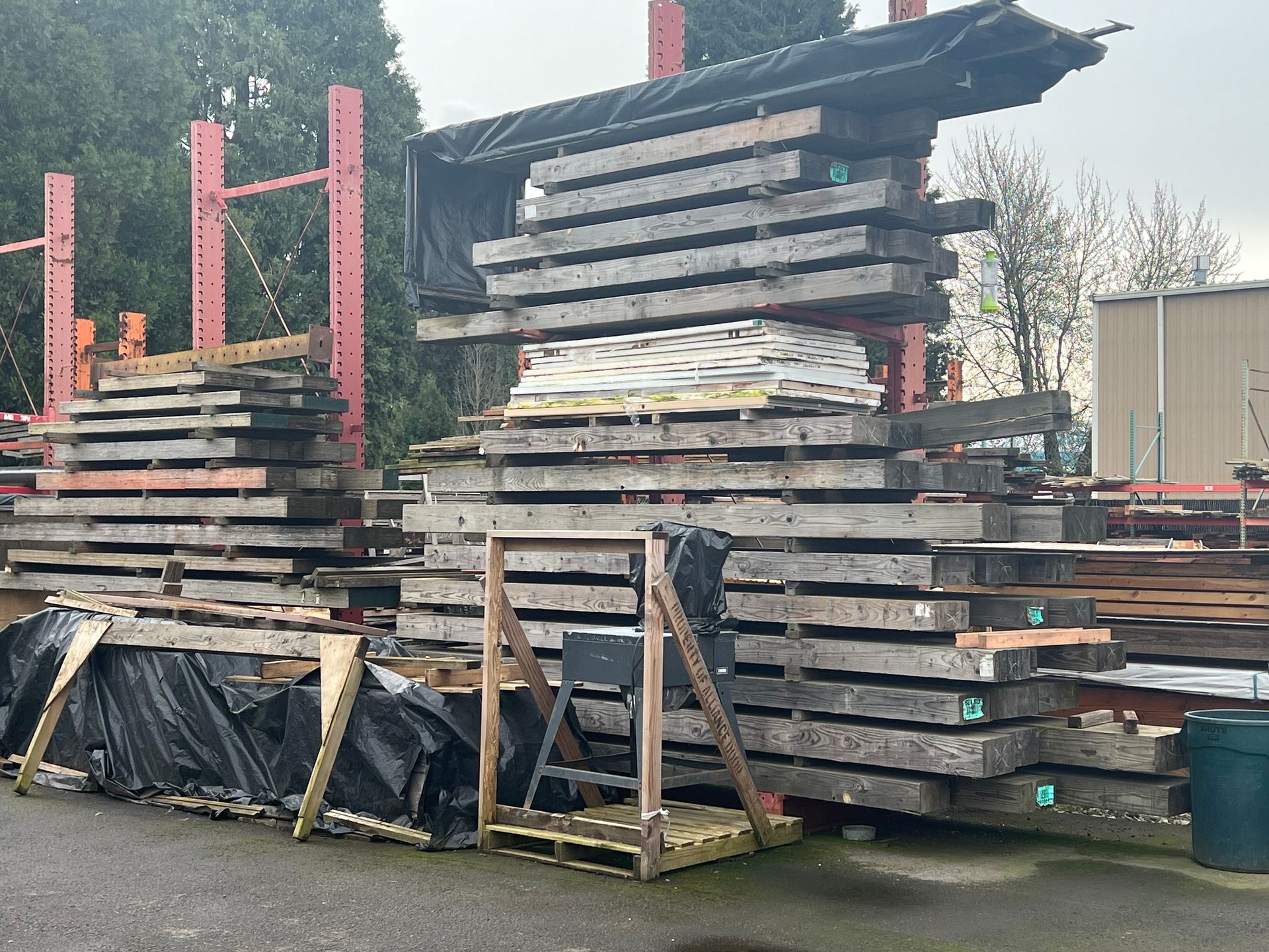 A large pile of wood is stacked on top of each other.