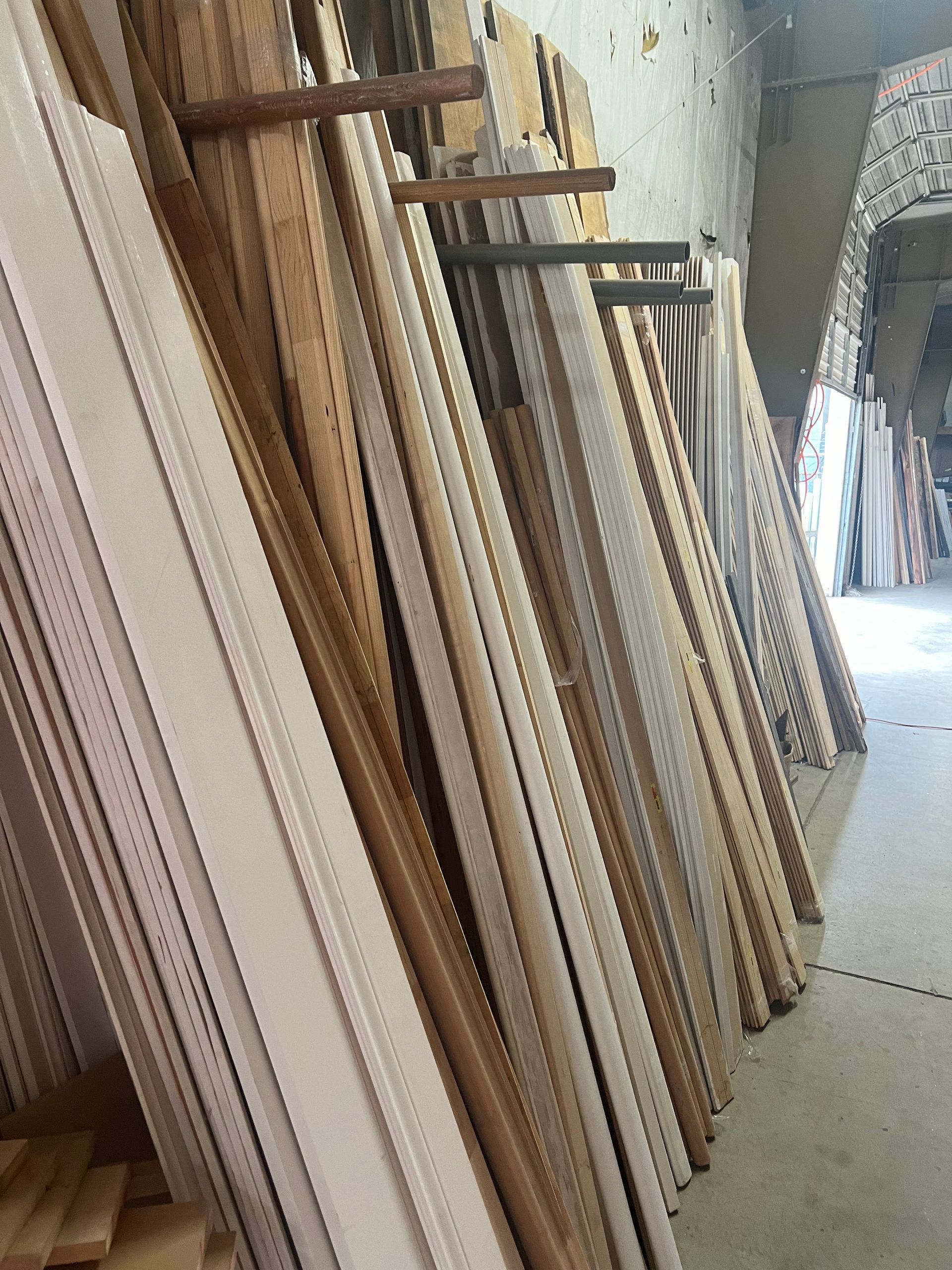 A warehouse filled with lots of wooden pieces.