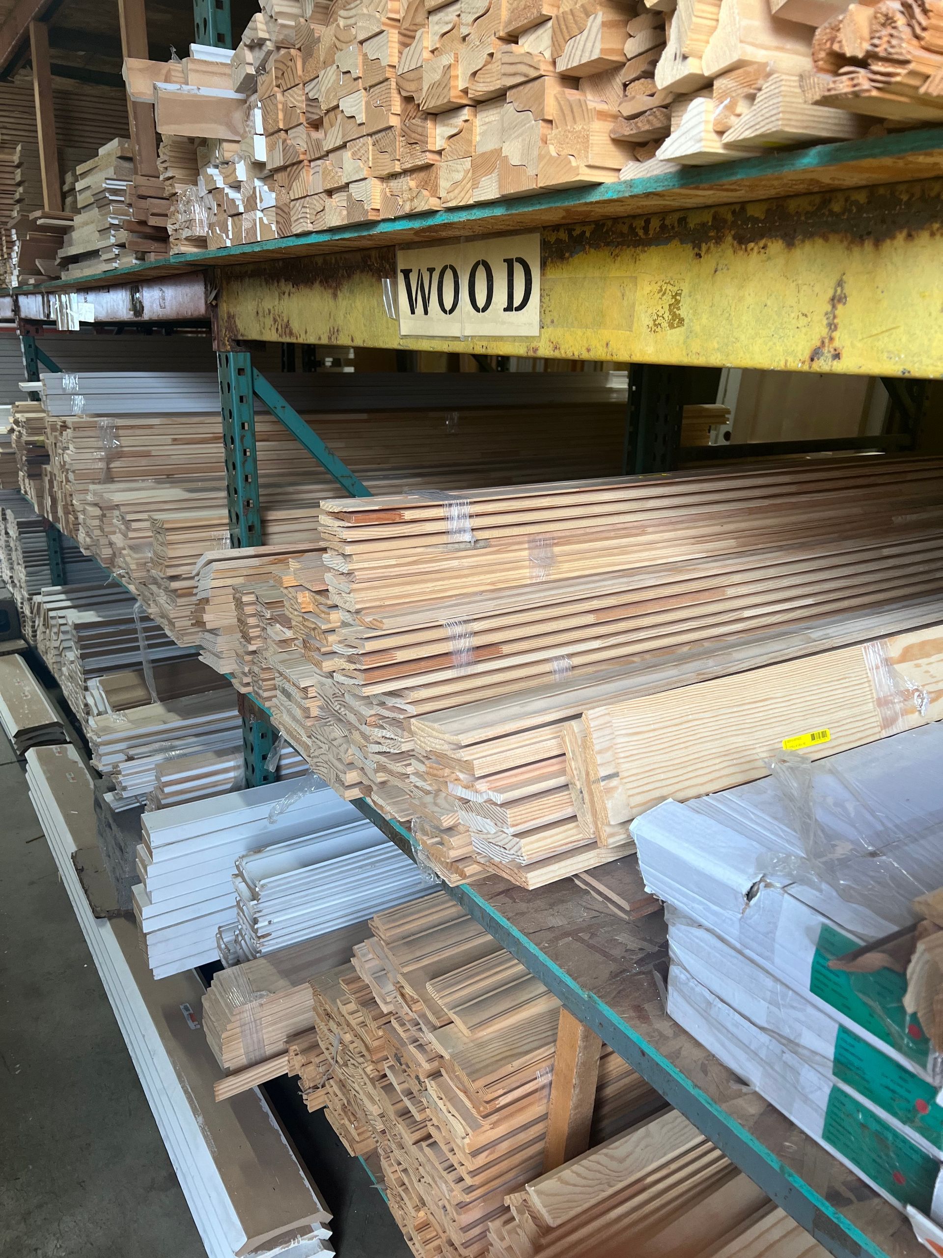 A warehouse filled with lots of wood and boxes.