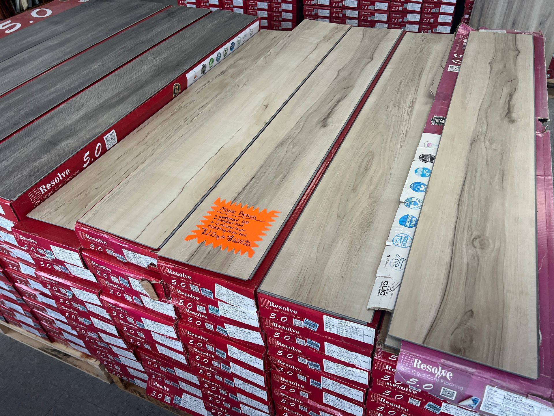 A stack of wooden flooring with a price tag on it.