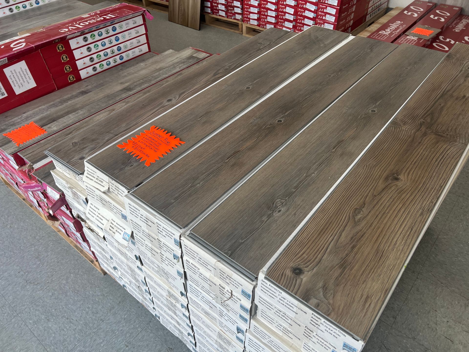 A stack of wooden flooring with a price tag on it.