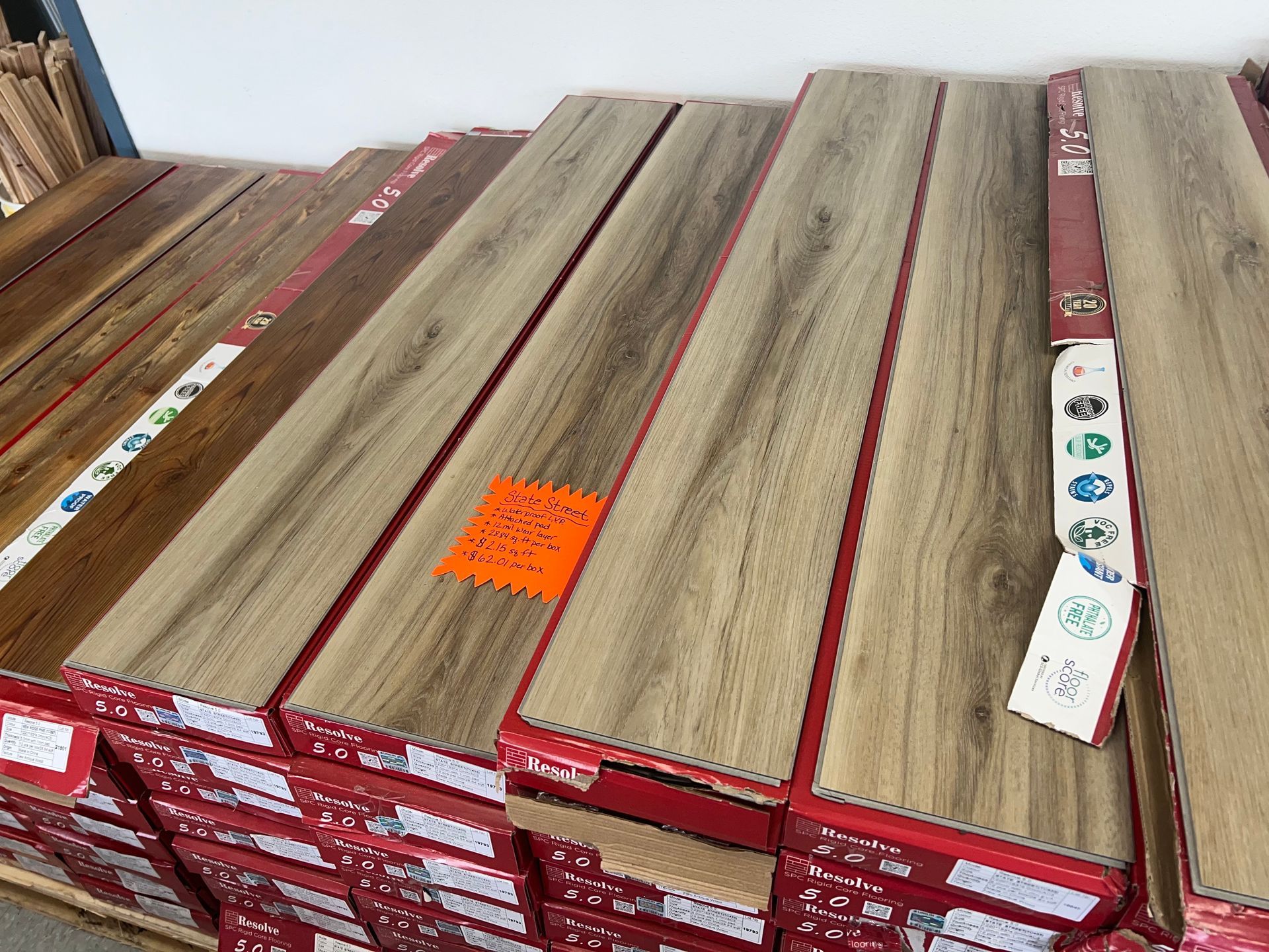 A stack of wooden flooring sitting on top of each other in boxes.
