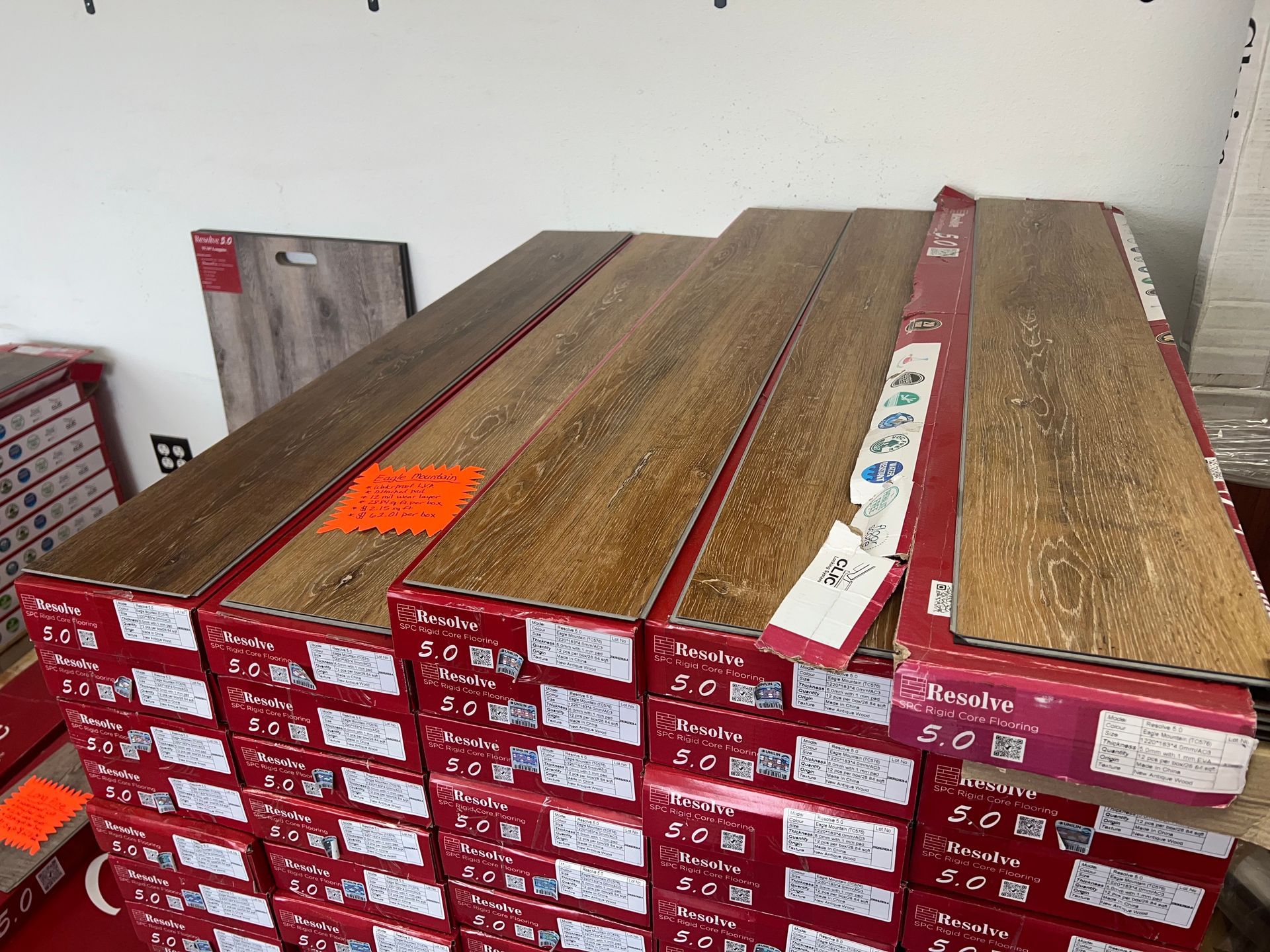 A stack of wooden flooring sitting on top of each other on a table.