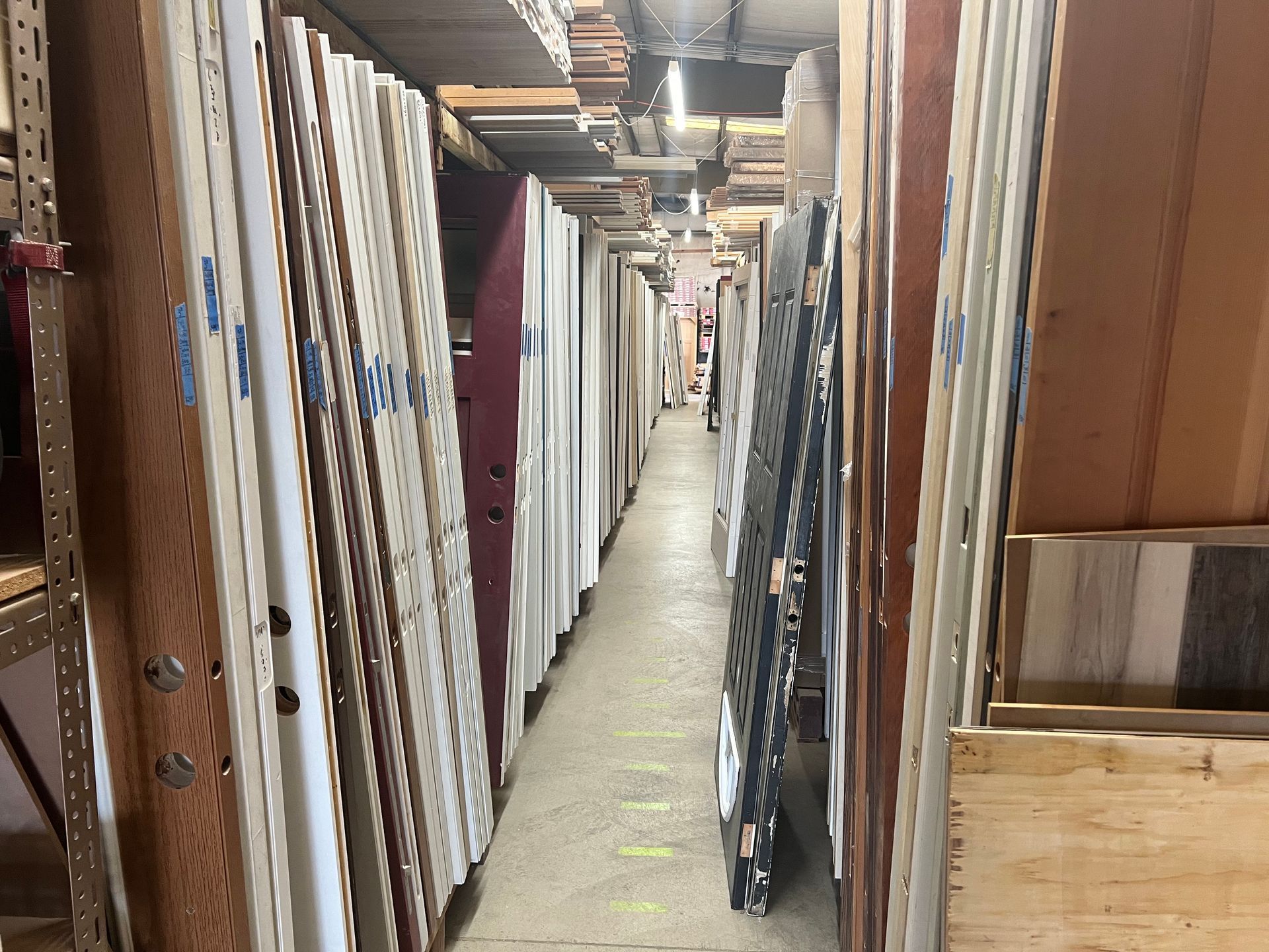 A long hallway filled with lots of wooden boards.