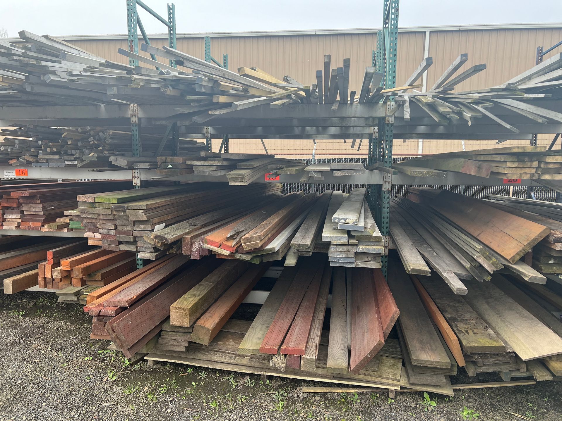A pile of wood is stacked on top of each other in a warehouse.