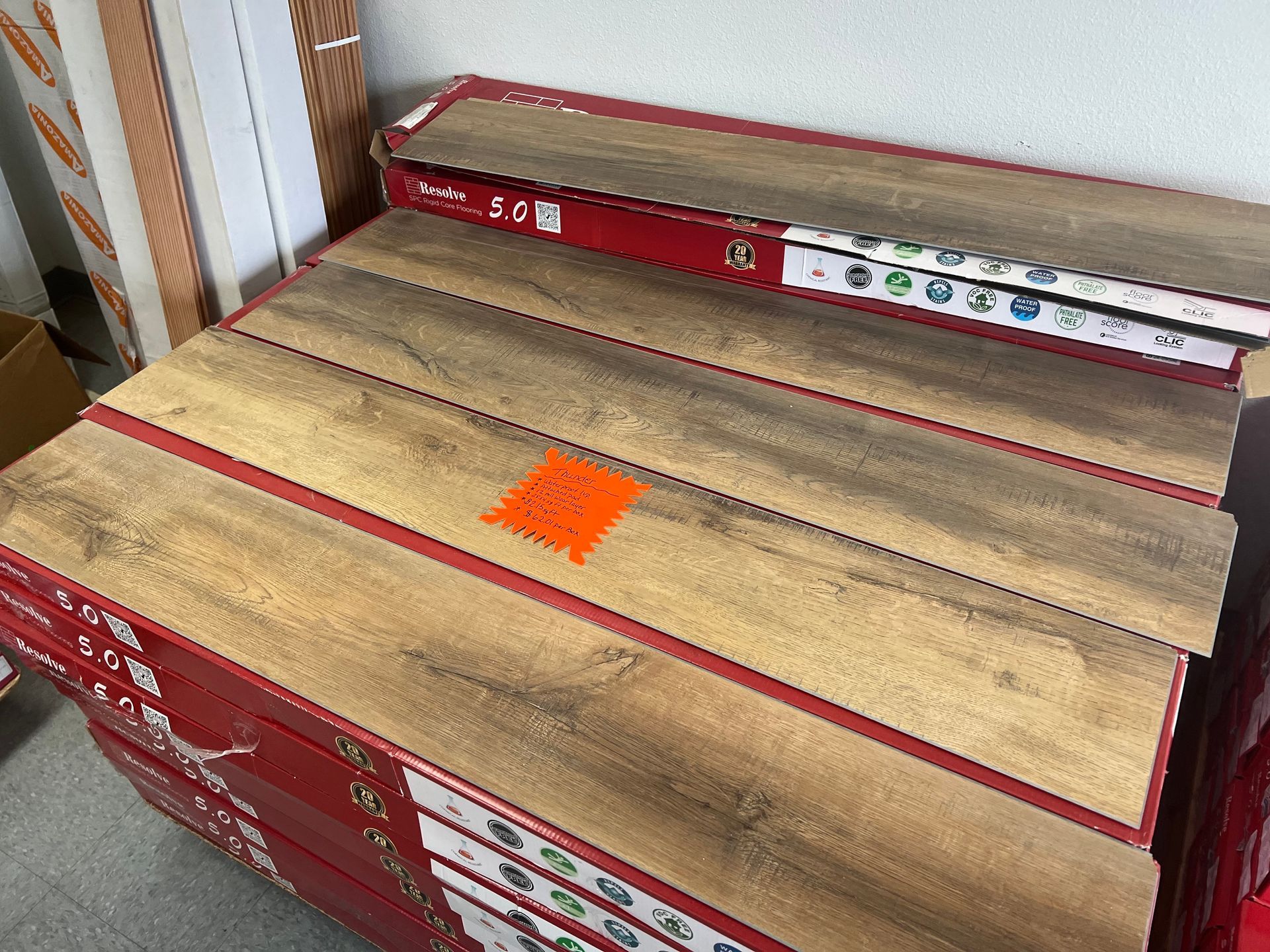 A stack of wooden flooring sitting on top of each other on a table.