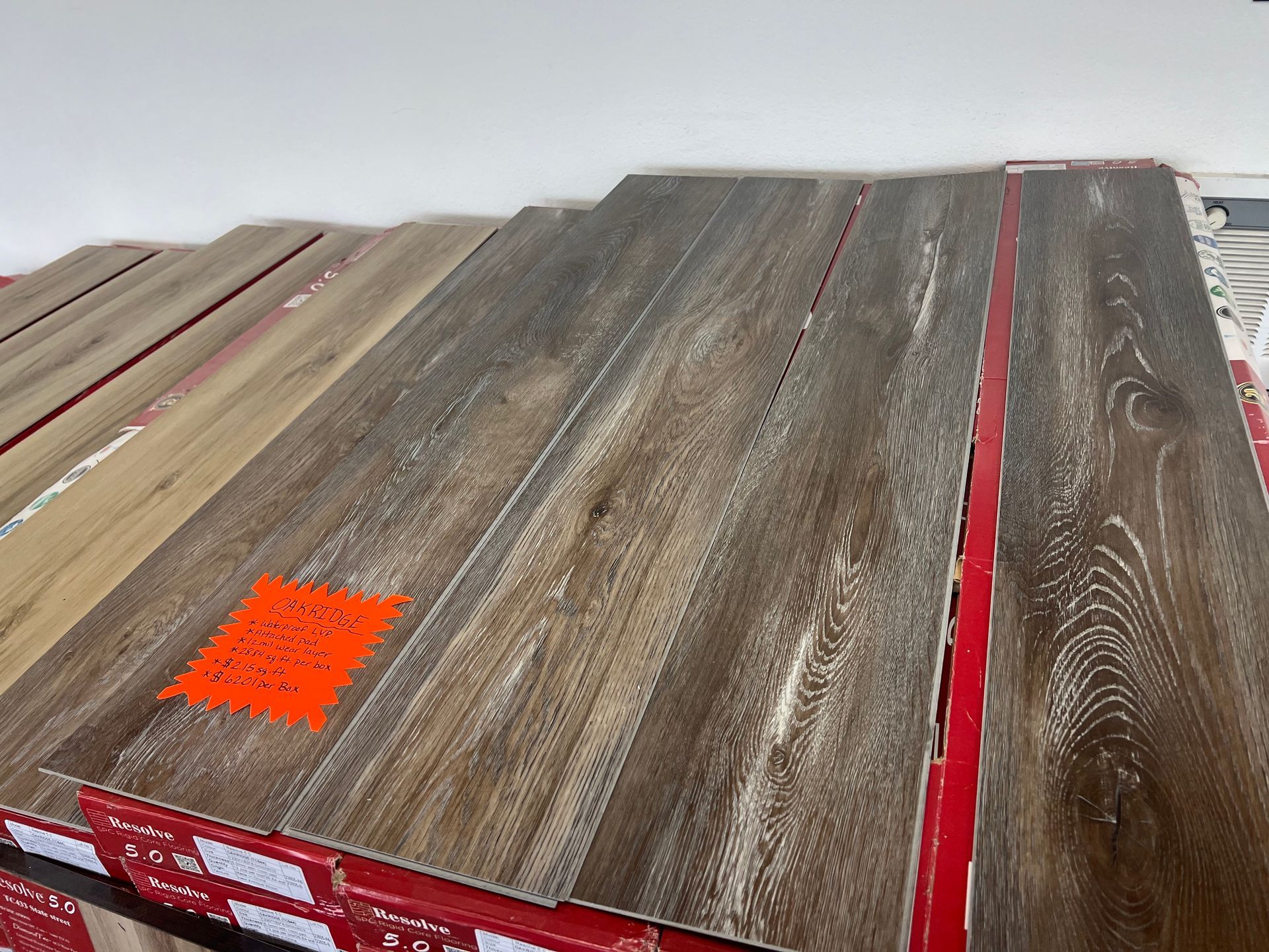 A stack of wooden flooring with a price tag on it.