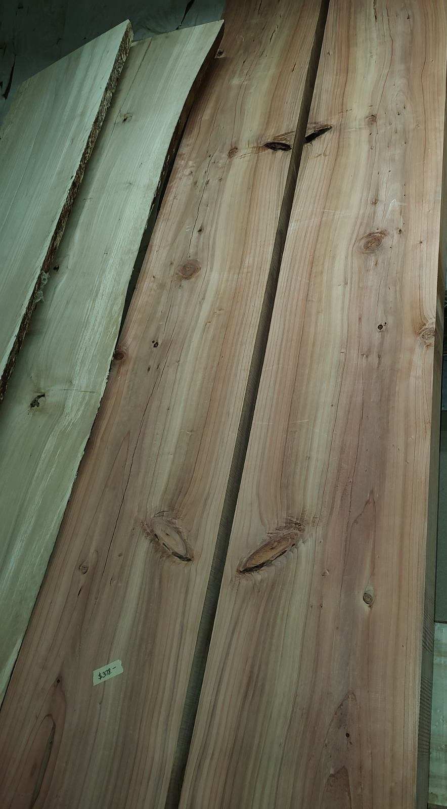 A stack of wooden boards sitting on top of each other on a table.