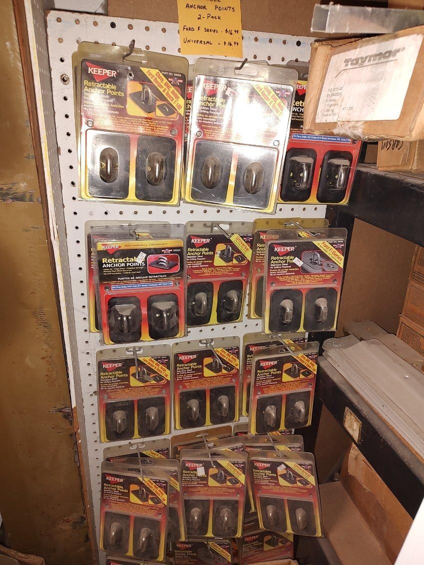 A shelf with a bunch of boxes of toys on it.