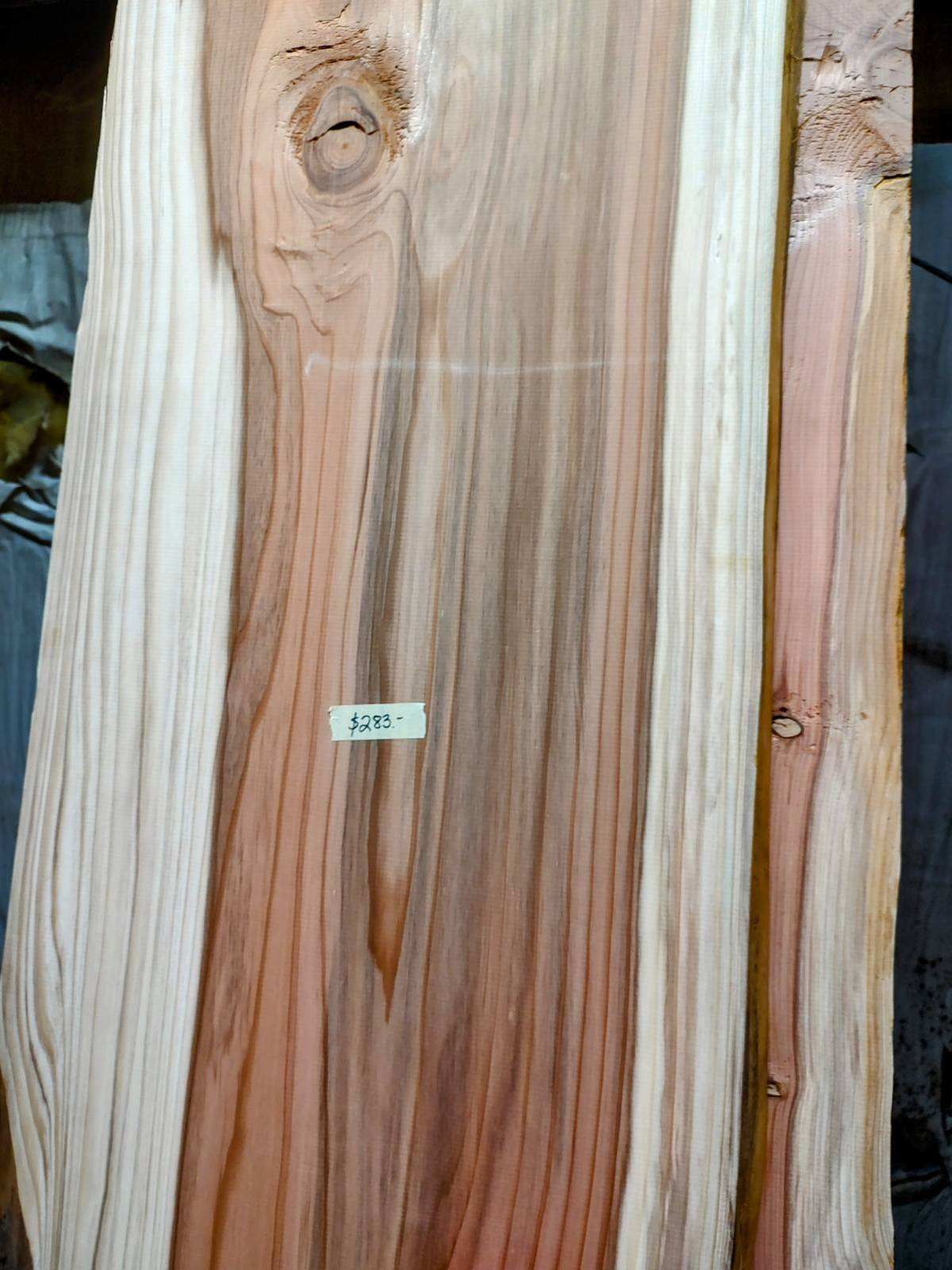 A close up of a piece of wood with a label on it.