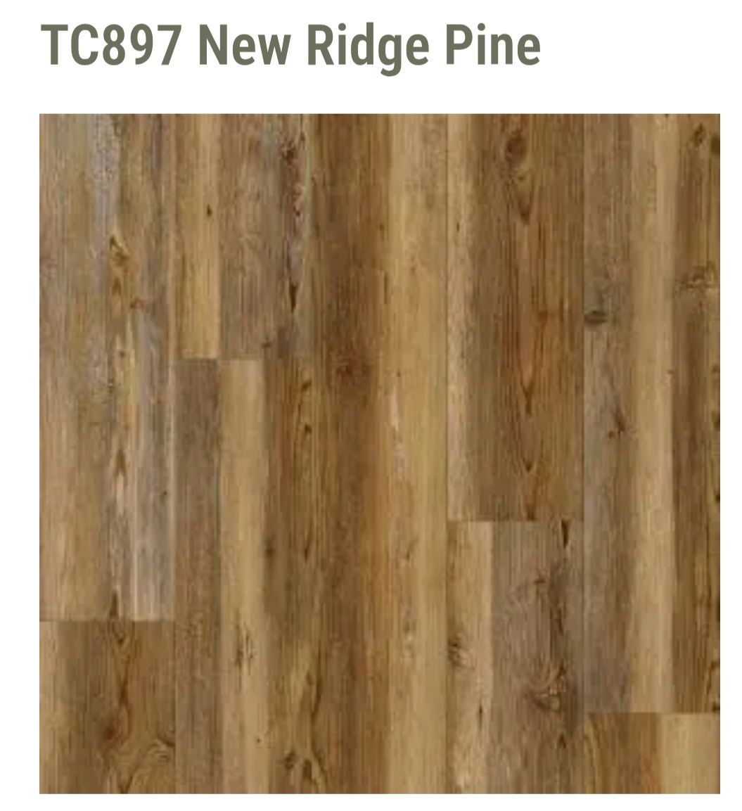 Sample of New Ridge Pine flooring featuring a medium-brown wood grain pattern with natural knots and color variations