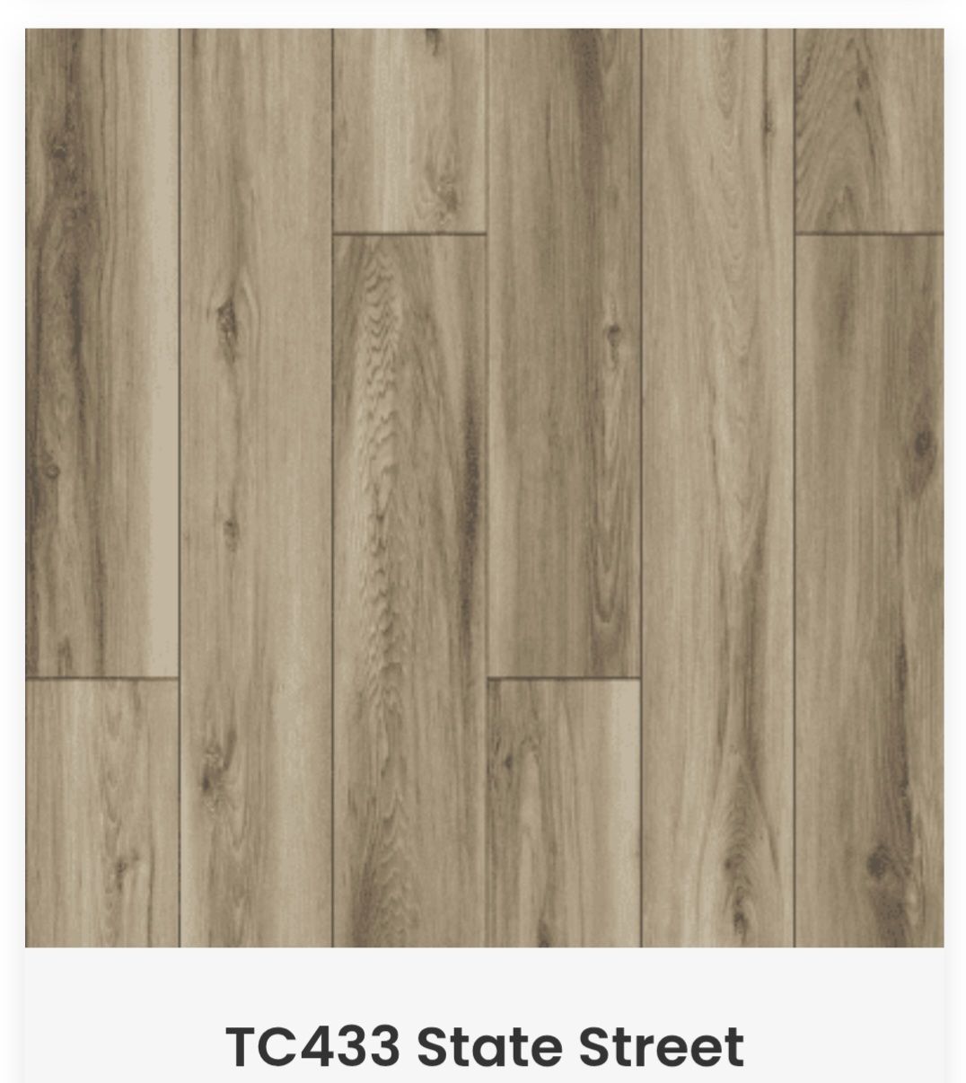 Light brown wood-grain flooring planks with natural knots and grain patterns, labeled TC433 State Street