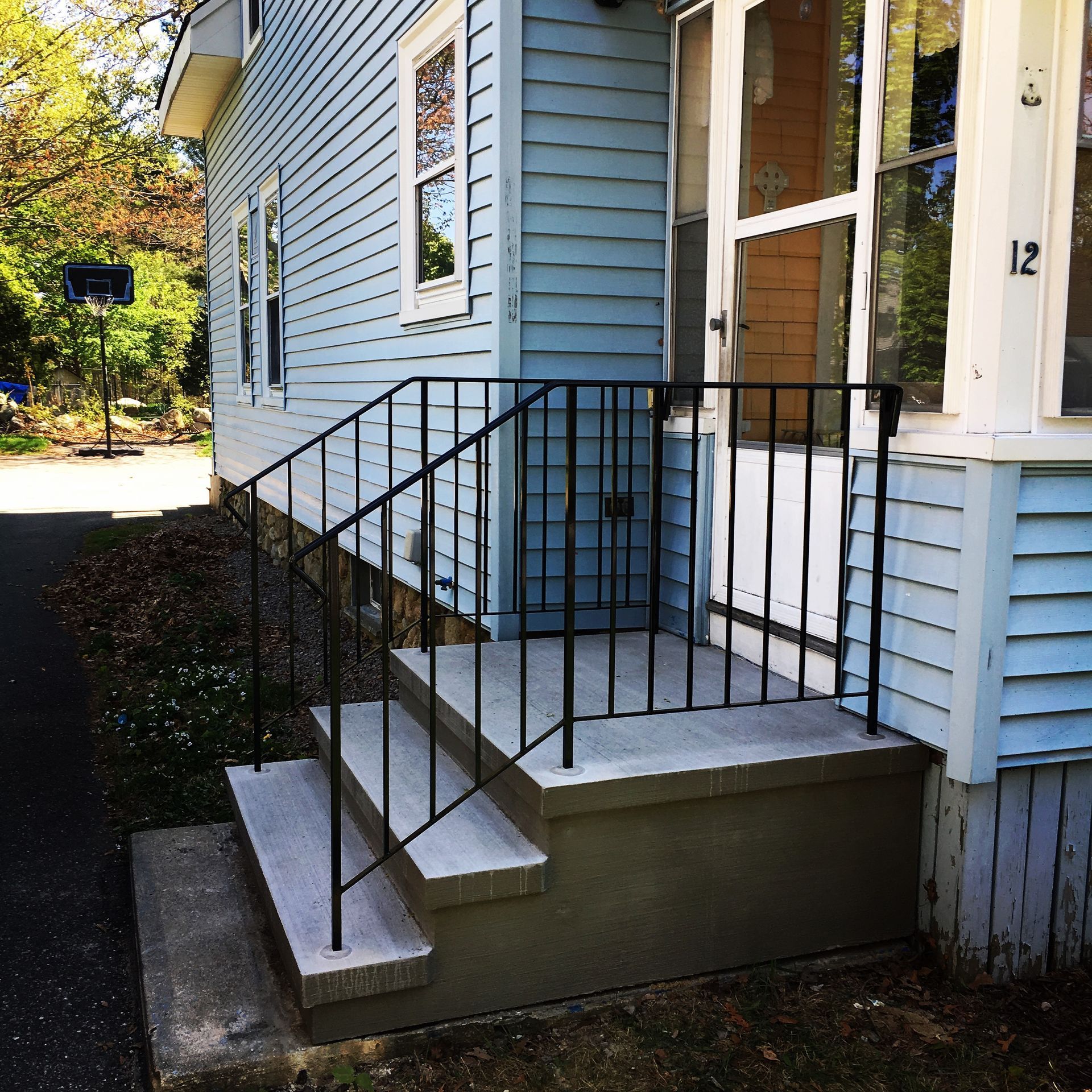 A blue house with the number 12 on it