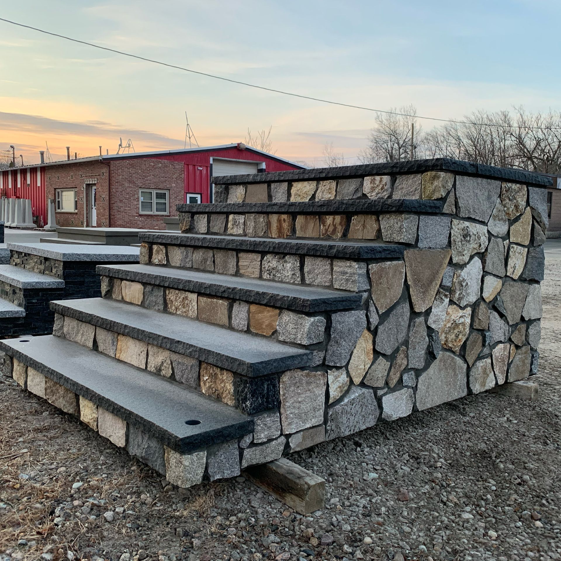 A stone wall with stairs leading up to it