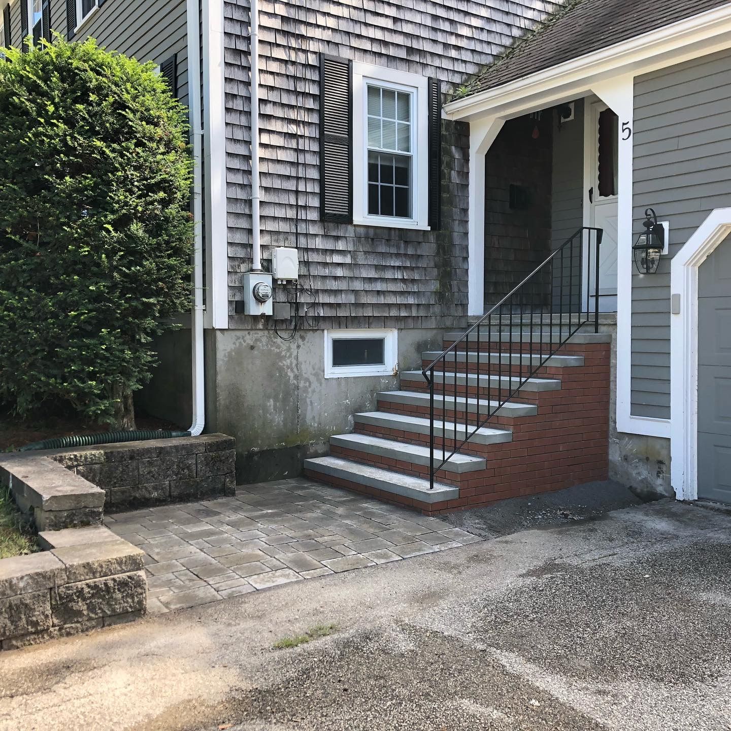 A house with stairs leading up to the front door