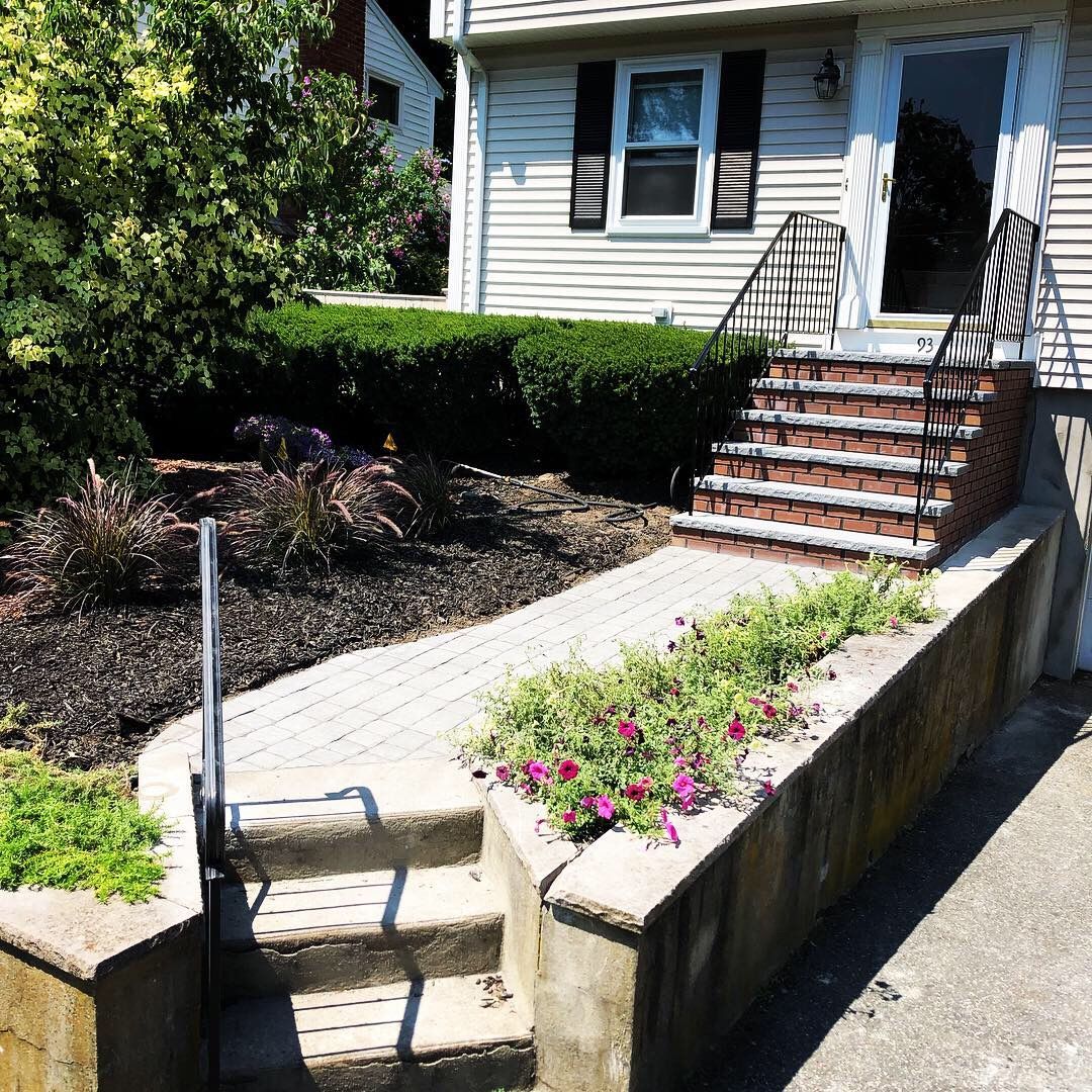 A house with stairs leading up to the front door