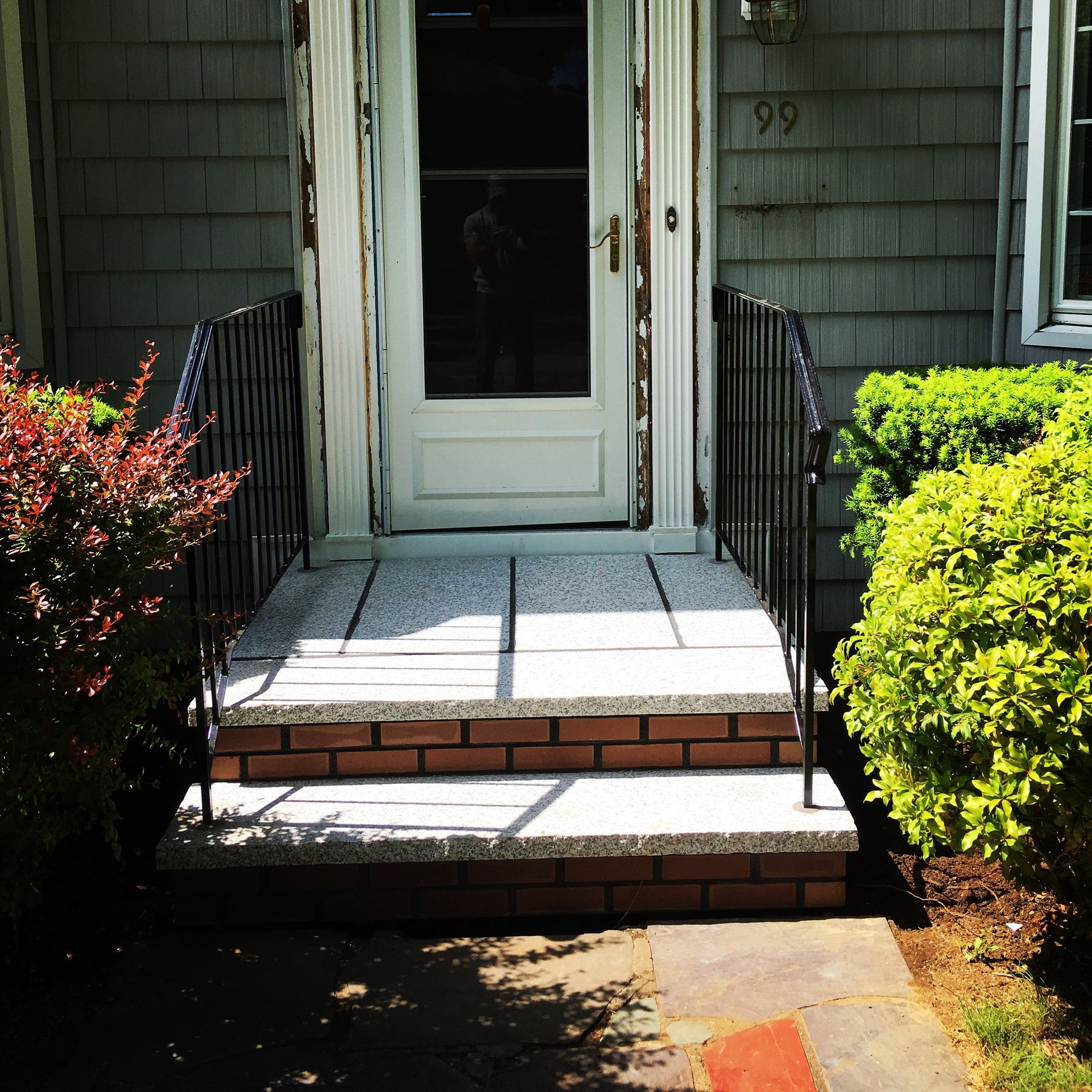 The number 99 is on the side of a house