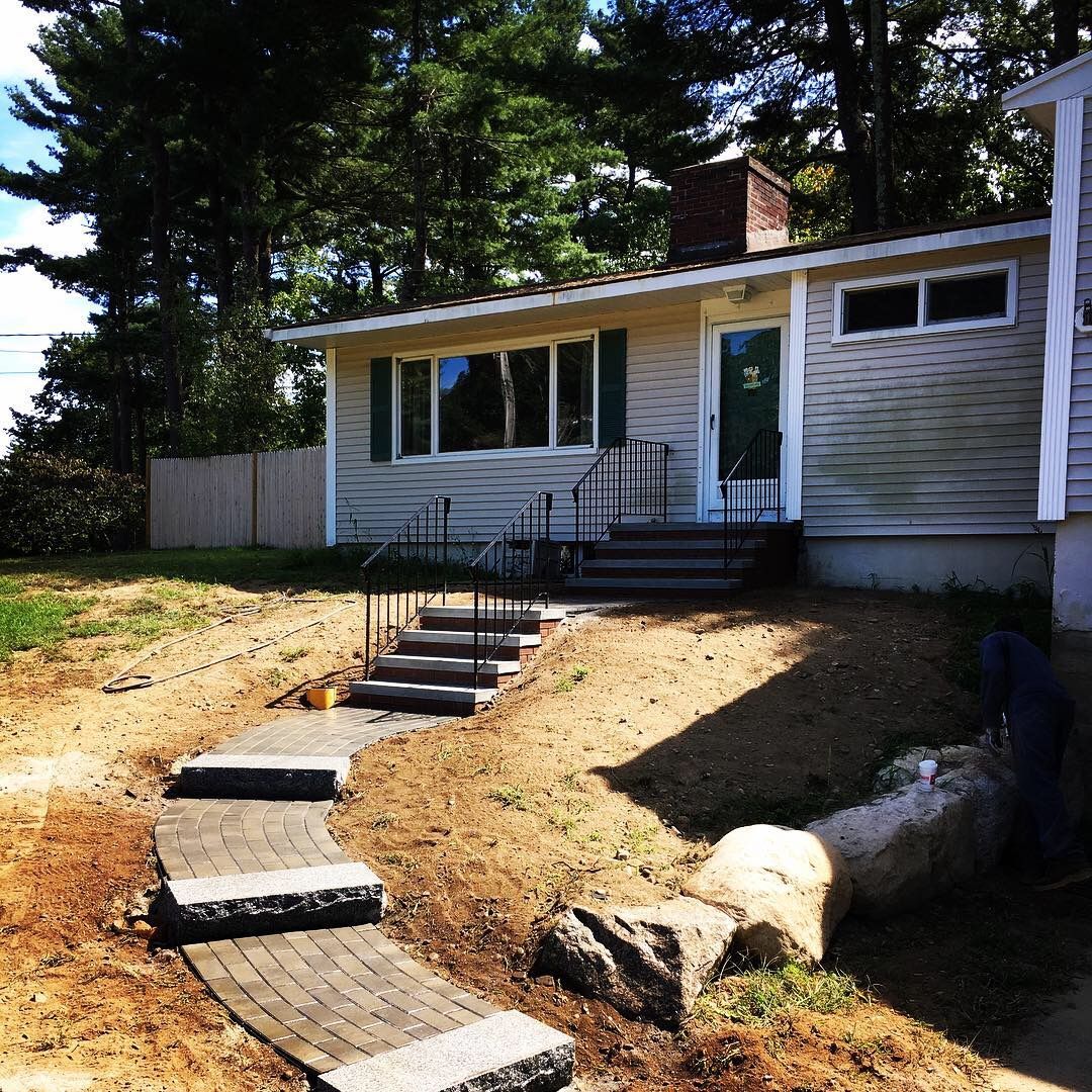 A house with stairs leading up to the front door