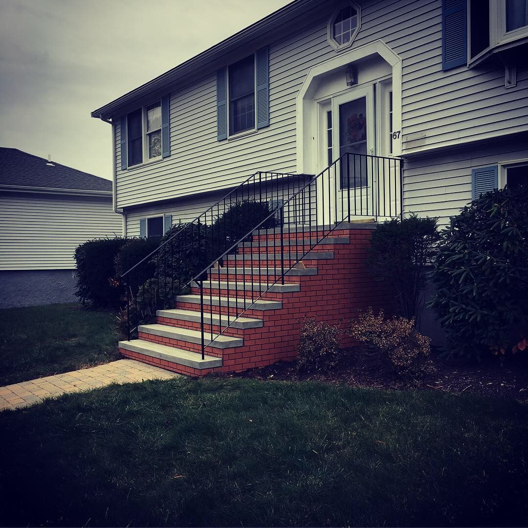 A house with stairs leading up to the front door