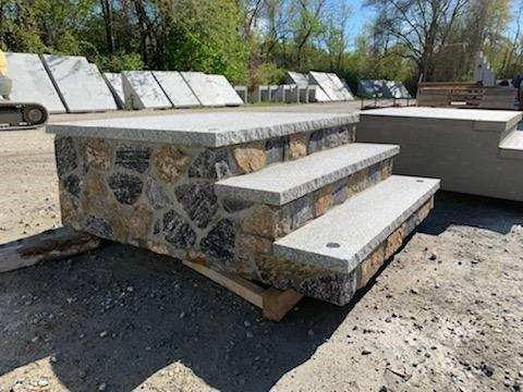 A stone staircase is sitting on top of a wooden pallet.