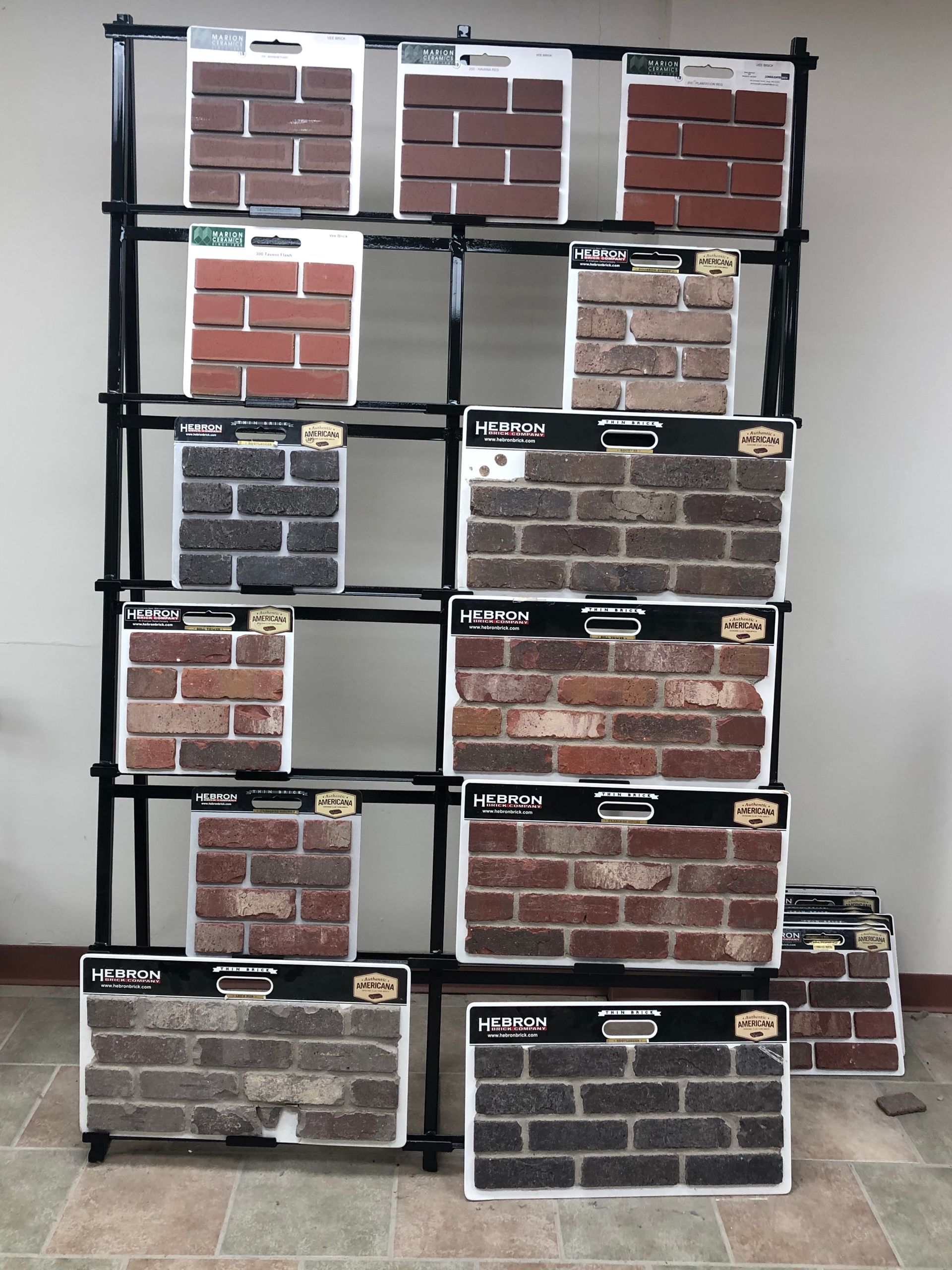 A display of different types of bricks on a rack