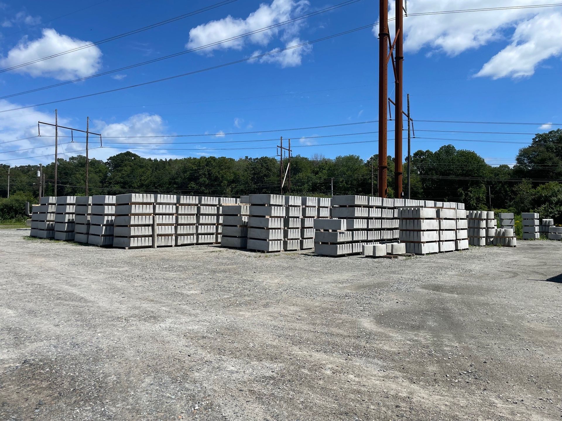 A pile of concrete blocks in a gravel area