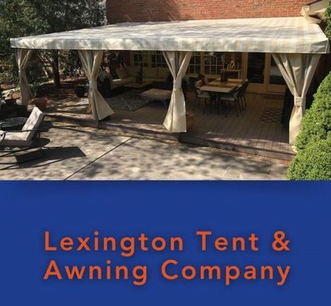 Patio with beige awning by Lexington Tent & Awning Company sign on blue background