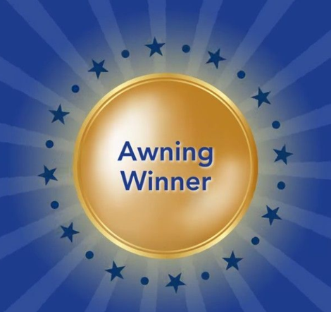 Gold award medallion on blue background with stars, reading “Awning Winner”