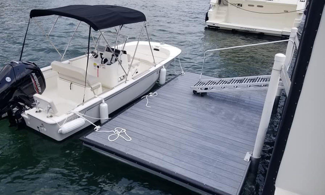 A boat is docked at a dock in the water.