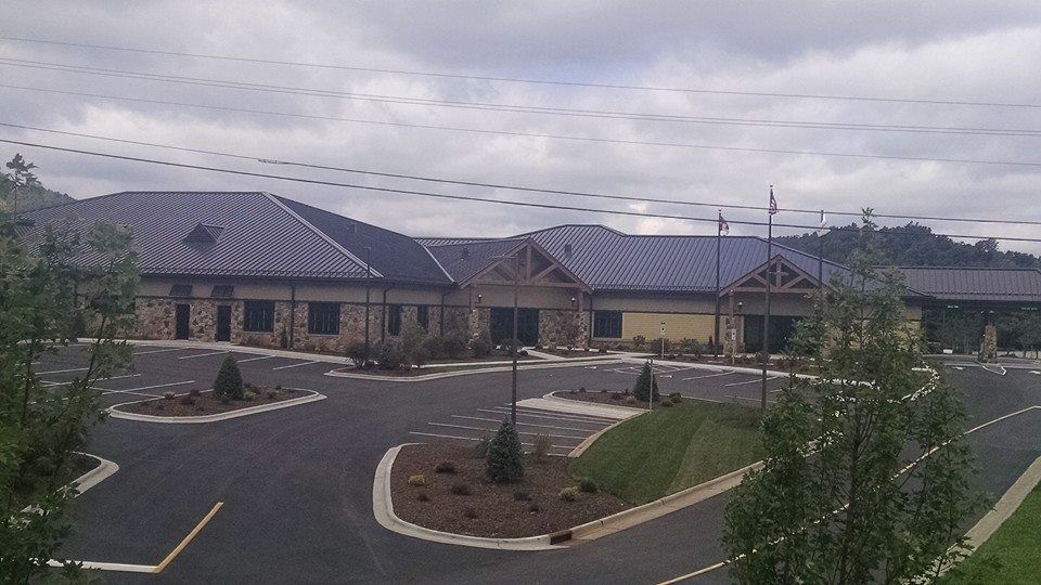 a large building with a parking lot in front of it