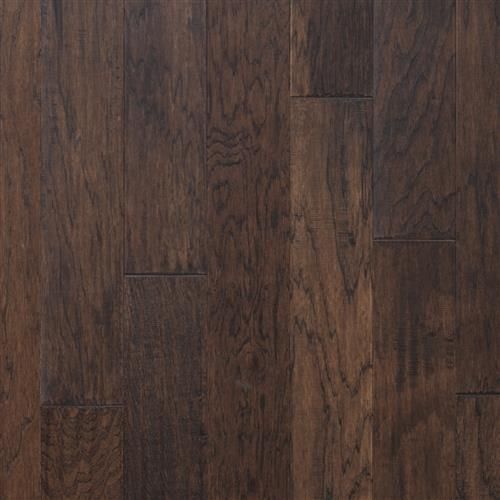 A close up of a dark brown hardwood floor.