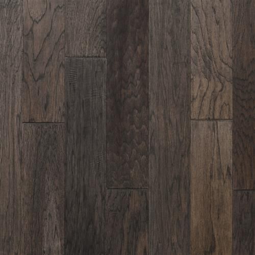 A close up of a dark brown hardwood floor.