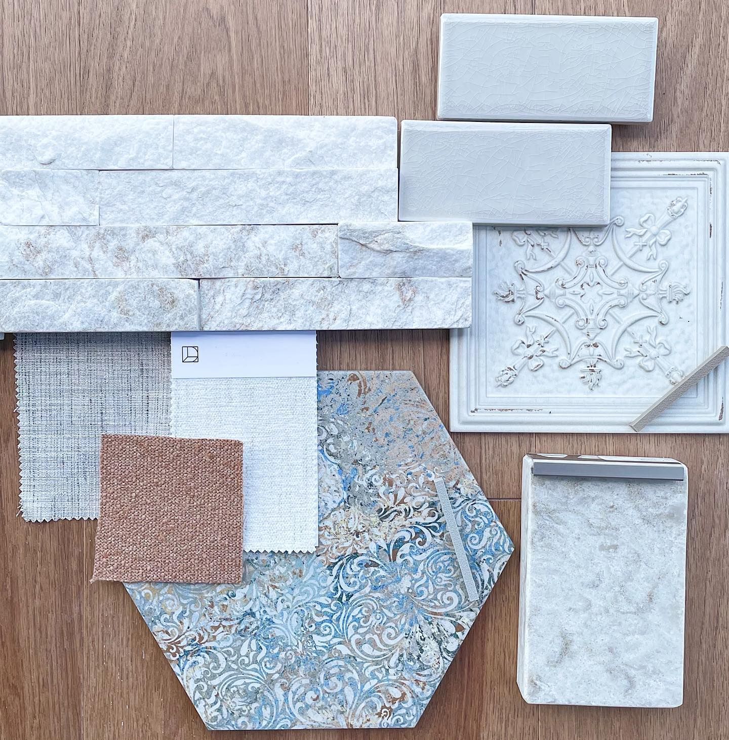 A bunch of tiles and a piece of paper with the letter d on it