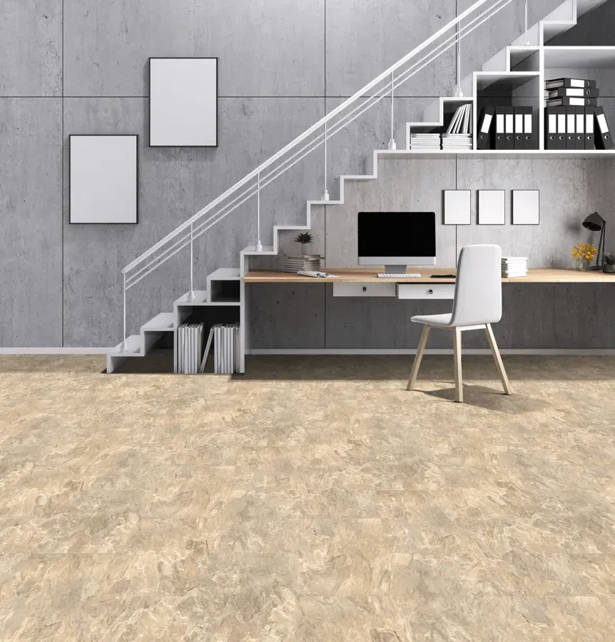 A home office with stairs and a desk with a computer on it