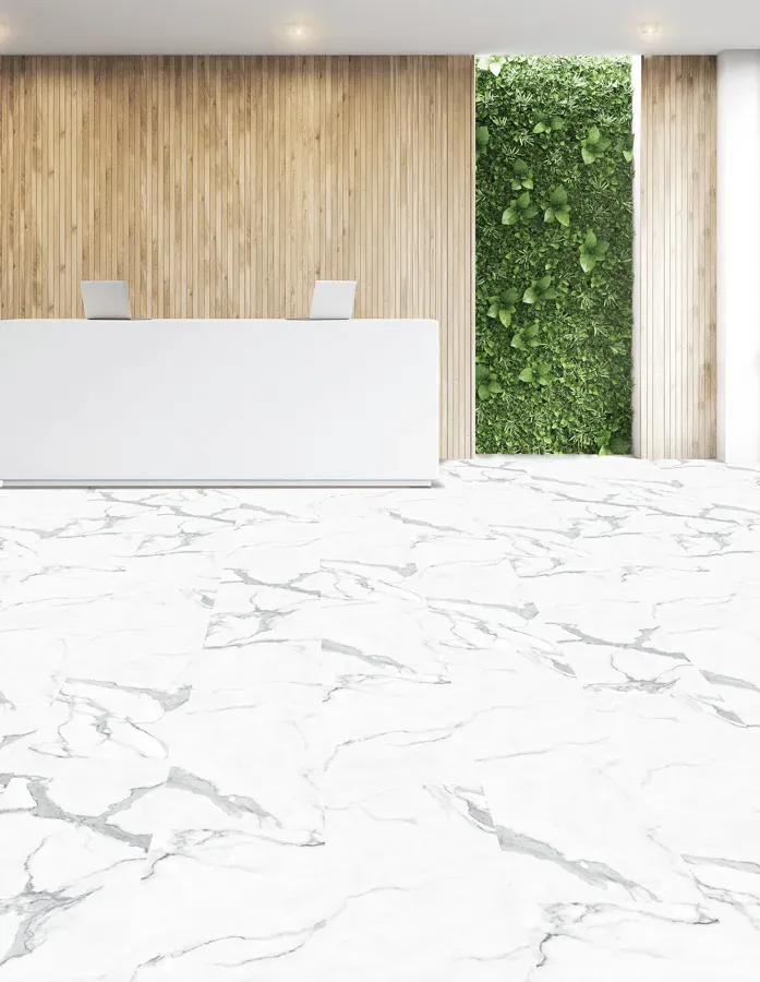 A reception area with a marble floor and a wooden wall.
