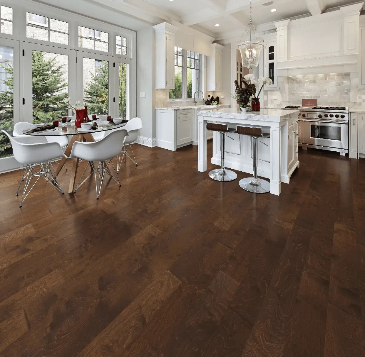 A kitchen with hardwood floors and a table and chairs