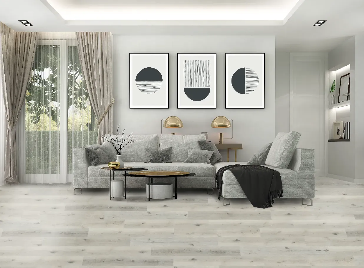 A living room with a couch , chair , coffee table and paintings on the wall.