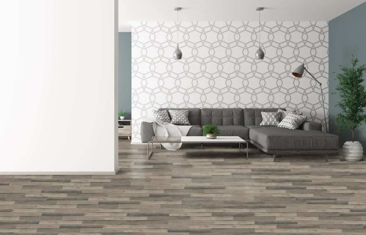 A living room with a couch , coffee table , and a white wall.