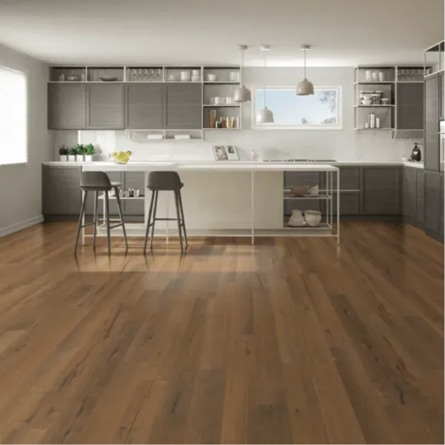 A kitchen with hardwood floors and gray cabinets