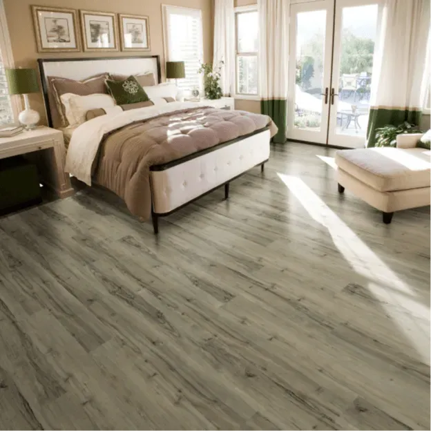 A bedroom with hardwood floors and a bed